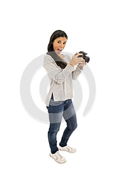Young beautiful hispanic photographer woman smiling happy taking photo with reflex camera