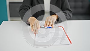 Young beautiful hispanic woman business worker giving contract to sign at the office