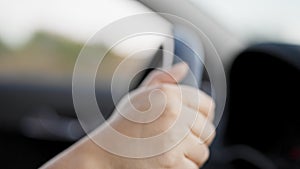 Young beautiful hispanic woman driving a car on the road