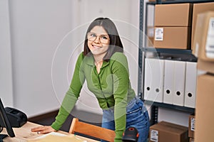 Young beautiful hispanic woman ecommerce business worker smiling confident standing at office