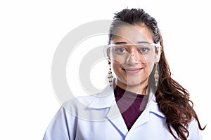 Young beautiful Indian woman doctor wearing protective glasses