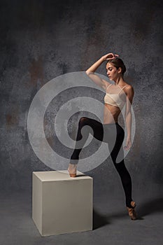 Young beautiful modern style dancer posing on a