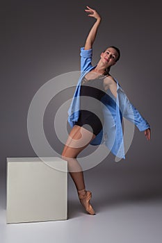 Young beautiful modern style dancer posing on a