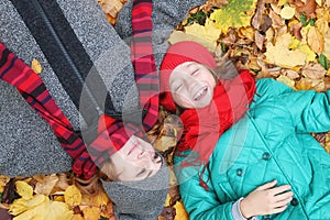 Young beautiful mother with her daughter on nature. A girl in a