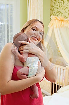 Young beautiful mother and newborn baby boy