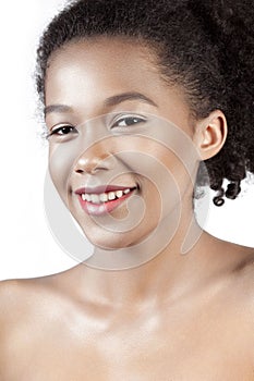 Young beautiful mulatto girl with clean perfect skin close-up
