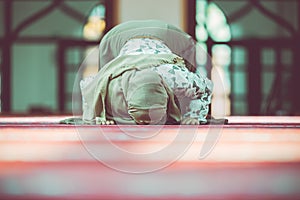 Young beautiful Muslim Woman Praying In Mosque