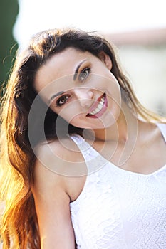 Young beautiful natural brunette woman at summer sunset portrait
