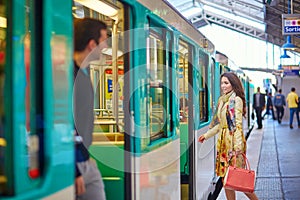 Young beautiful Parisian woman in subway