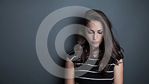 Young beautiful pensive woman portrait studio