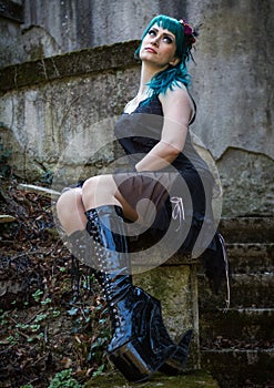 Young beautiful pin up glamour girl with green color hair, high