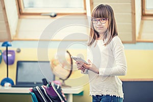 Young of beautiful pre-teen girl with tablet laptop pc. Education technology for teenagers - adolescents children photo