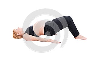 Young beautiful pregnant woman making sport exercises for health