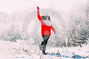 Young Beautiful Pretty Caucasian Girl Woman In Blue Sunglasses Dressed In Red Jacket And White Hat Smiling And Jumping
