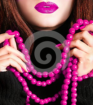 Young beautiful pretty young fashion model woman lady girl with bead necklace and pink makeup