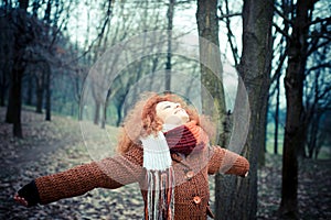 Young beautiful red curly hair woman