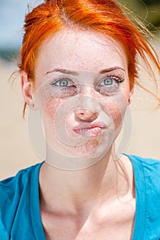 Young beautiful redhead freckled woman photo