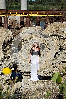 Young beautiful redhead woman in dress barefoot