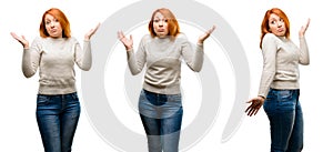 Young beautiful redhead woman isolated over white background