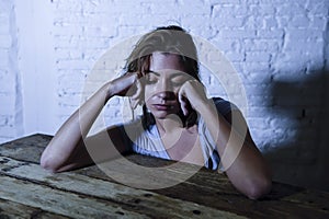 Young beautiful sad and depressed woman looking wasted and frustrated suffering pain and depression feeling low and break down photo