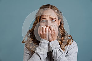 Young beautiful scared woman shocked covering mouth with hands for mistake