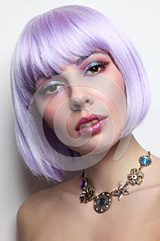 Beautiful girl with violet hair and fancy make-up