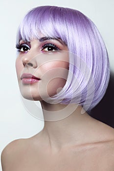 Young beautiful girl with violet hair and fancy make-up