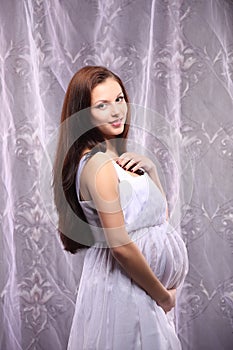 Young beautiful and stylish pregnant woman