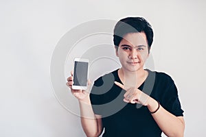 Young beautiful short hair asian woman holding blank black screen smart phone on white background. Indonesia women.