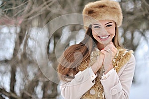 Young beautiful smiling girl face outdoors