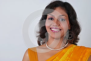 Young beautiful smiling Indian woman for advertisi