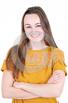 Young beautiful smiling portrait woman with arms crossed in white background