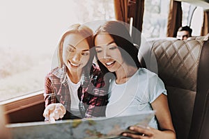 Young Beautiful Smiling Women Holding Paper Map