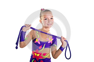 Young beautiful sport girl doing gymnastic with jumping rope