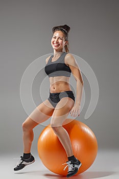 The young, beautiful, sports girl doing exercises