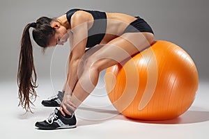 The young, beautiful, sports girl doing exercises