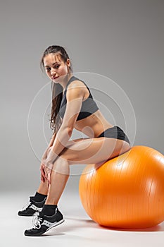 The young, beautiful, sports girl doing exercises