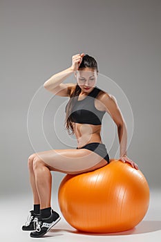 The young, beautiful, sports girl doing exercises