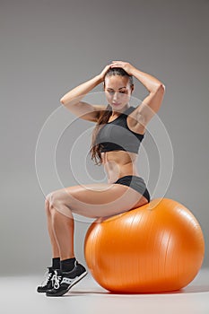 The young, beautiful, sports girl doing exercises