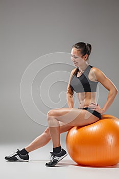 The young, beautiful, sports girl doing exercises