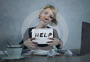Young beautiful and stressed business woman working overwhelmed and depressed at office laptop computer desk asking for help feeli