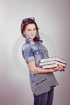 Young and beautiful student with books