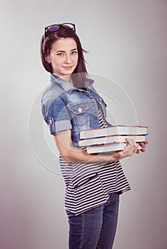 Young and beautiful student with books