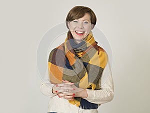 Young beautiful and stylish 30s red hair woman sweater and Autumn colorful scarf smiling happy