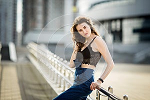 Young beautiful stylish hipster woman drinking coffee in paper