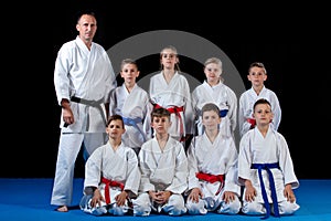 Young, beautiful, successful multi ethical karate kids in karate position.