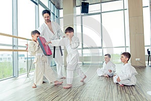 Young, beautiful, successful multi ethical kids in karate position
