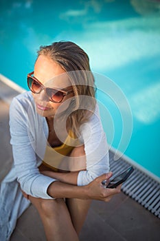 Young Beautiful Suntanned Woman wearing sunglasses