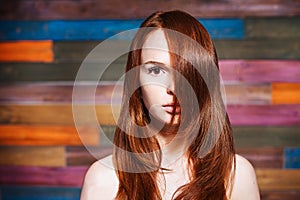 Young beautiful teen with red hair