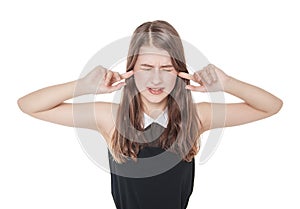 Young beautiful teenager girl plugging ears with fingers isolate photo